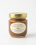 A 250 g jar of Eat Raw Honey raw creamed cinnamon honey